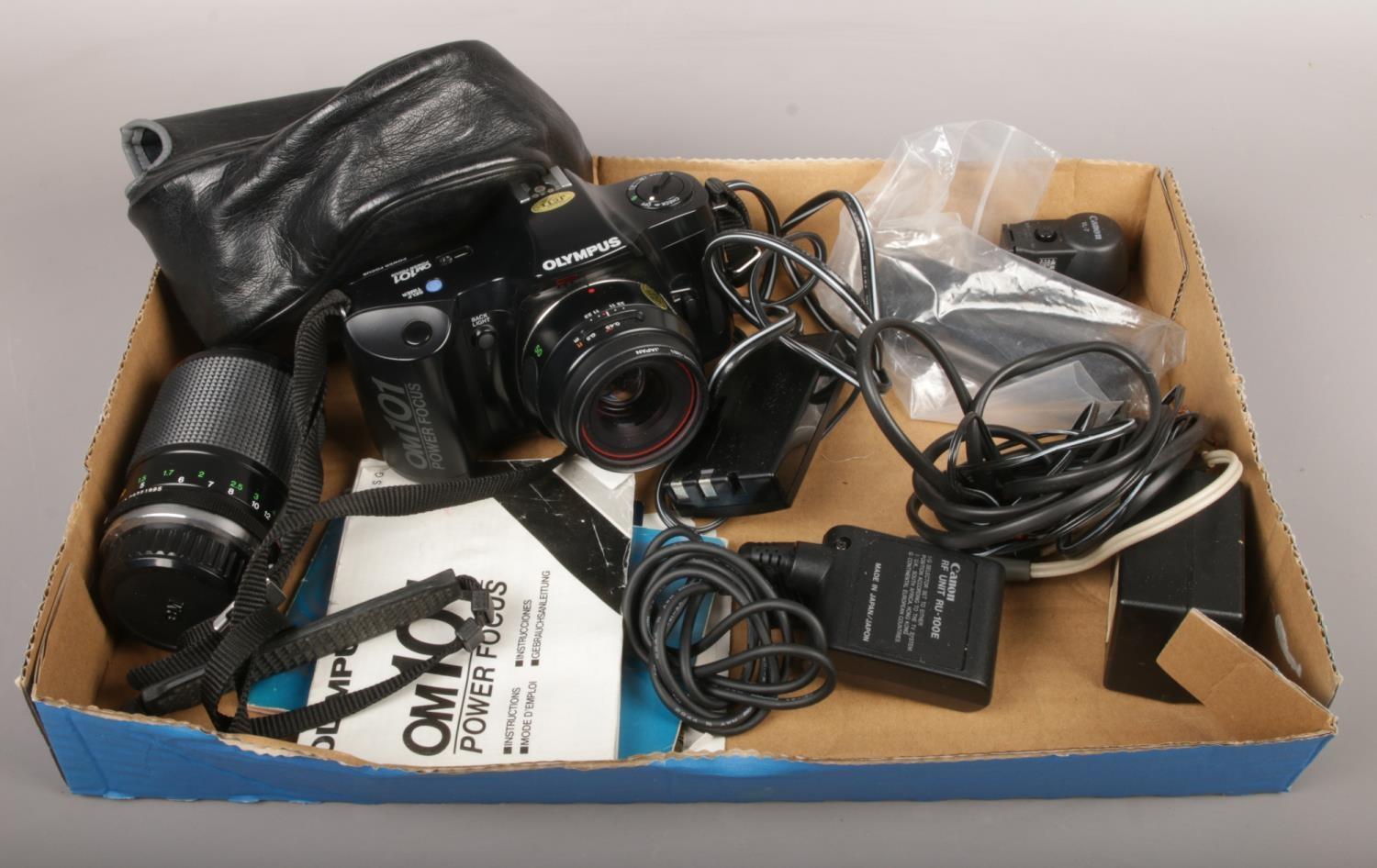 An Olympus OM101 camera, with macro lens, booklet and accessories.