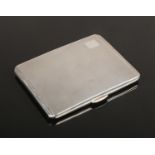 An Art Deco silver cigarette case with engine turned engraving by Smith & Bartlam. Assayed