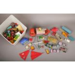 A box of vintage children's toys, mainly die cast models including Corgi, Dinky and Triang.