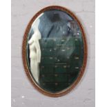 A Gilt framed oval mirror ( approx 53 cm wide)