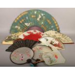 A collection of oriental hand fans.