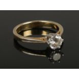 A silver ring set with a single cubic zirconia stone, size P
