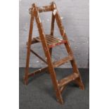 A set of wooden step ladders.