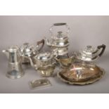 A collection of assorted silver plated wares. Including a spirit kettle on stand, Masonic ewer, pair