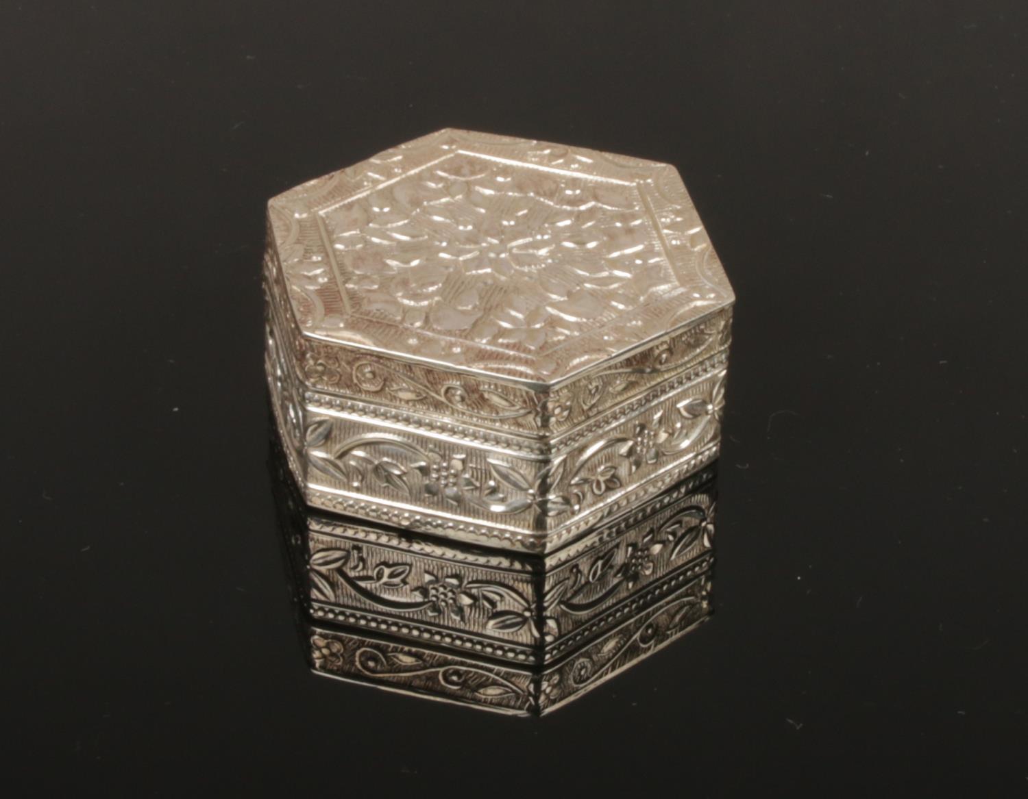 A Continental hexagonal silver pill box. Stamped 800.