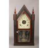 A 19th century American carved rosewood cathedral clock. With painted dial, incorporating an alarm