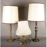 Three table lamps, to include two large examples.