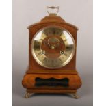 A Dutch 8 day bracket clock in figured walnut case. With brass chapter ring and dial signed Warmink.