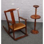 A child's rocking chair and smokers stand.