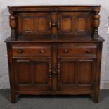 An Ercol court cupboard.