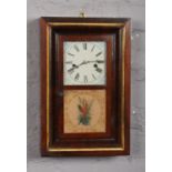 An American Waterbury Clock Co. rosewood cased wall clock. With painted square dial and striking