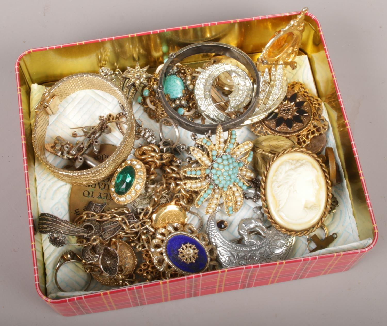 A box of costume jewellery, brooches, bangles, necklaces etc