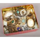 A box of costume jewellery, brooches, bangles, necklaces etc