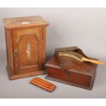 An oak smokers cabinet, leather cigar pouch, brass and oak crumb scoop, small collection of re