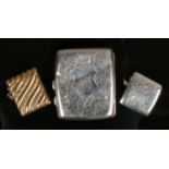 A silver cigarette case, Birmingham 1904, a silver vesta case, Birmingham 1903 and a brass vesta