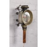 A Victorian carriage lantern, with wall mounting bracket. Crack to both panes of glass.
