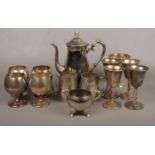 A collection of Silver plate, Goblets, Tea pot, milk jug etc