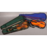 A cased vintage violin and bow, along with a cased Skylark violin with two bows.