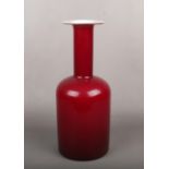 A Holmegaard Gulvase vases designed by Ottoe Brauer. Cherry red on a white interior, 43cm high. Good