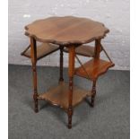 A mahogany occasional table with drop down sides.