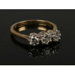 A 18ct gold 3 stone diamond ring, approximately 1 carat diamond, size N, gross weight 3.85g.