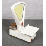 A set of vintage enamel Berkel shop counter scales.