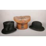 A gentleman's top hat in leather case, marked Special Quality, along with a bowler hat York
