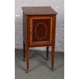 A Victorian mahogany pot cupboard crossbanded in satinwood.