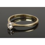 An 18ct gold and diamond solitaire ring, Size M. (1.65g).