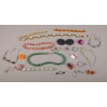 A tray of vintage costume jewellery including a chrome Art Deco bracelet, beads, rings and