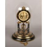 A Shatz & Sohne brass torsion clock under glass dome. With black chapter ring, column supports and