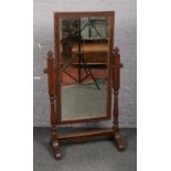 A George V oak and mahogany cheval dressing mirror, 31cm.