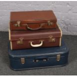 A collection of Vintage suitcases, with leather example