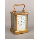 A brass cased 8 day carriage clock of small proportions. With platform escapement and having