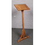 A Gothic style oak church lectern, signed J. S. Jackson to base. (height 113cm, slope size 25cm x