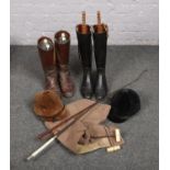 A collection of horse riding equipment, to include boots, hats, crops etc.