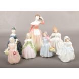 A collection of Royal Doulton porcelain figures of girls, to include The Peggy Davies Collection