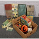A box of miscellaneous to include vintage tinplate house, annuals, pool balls etc.