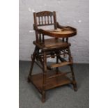 A vintage mahogany metamorphic child's high chair.