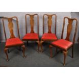 A set of four mahogany Queen Anne style dining chairs.