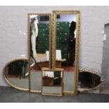 A collection of gilt frame mirrors.
