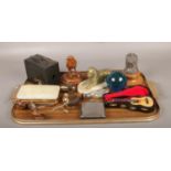 A tray of collectables, to include carved wooden bird, cork screws, box camera etc.