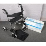 A Roma folding mobility walker along with a boxed Deltis Bathermaster.