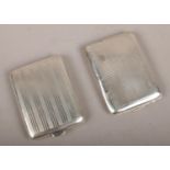 Two small silver cigarette cases to include assayed Birmingham 1925 by D Bros, 61g.