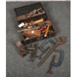A wooden box and contents of vintage hand tools.