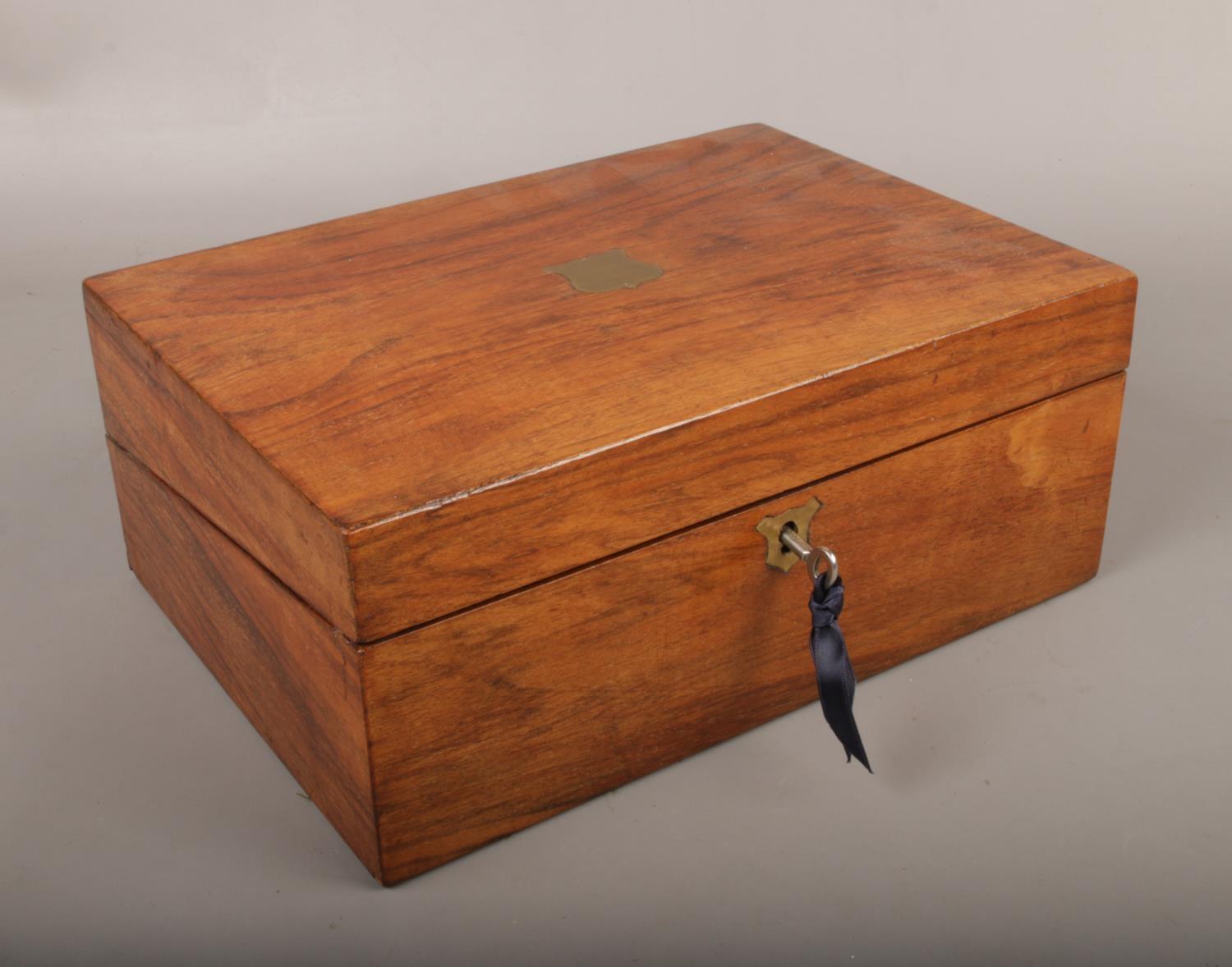 A Victorian mahogany writing slope, with key.