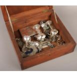 A workbox containing assorted white metal items including a perpetual calendar cigarette case,