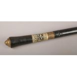 An ebonised sword stick, with brass lion mask pommel. (Length 92cm).