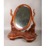 A Victorian carved mahogany toilet mirror. (Height 72cm).