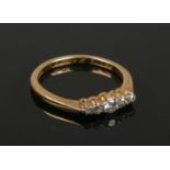 An 18ct gold and platinum five stone diamond ring. Size K, 2.13g gross weight.